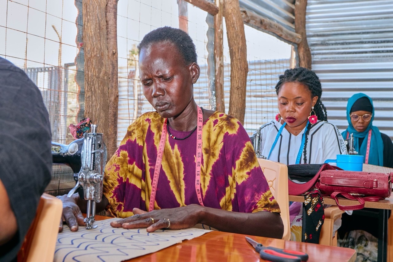 Tailors at work inside BALWA Africa Enterprise's training hub in Kakuma Refugee Camp, Kenya.