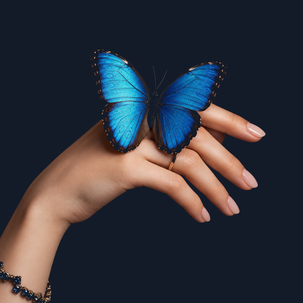 A blue morpho butterfly resting on a woman’s hand